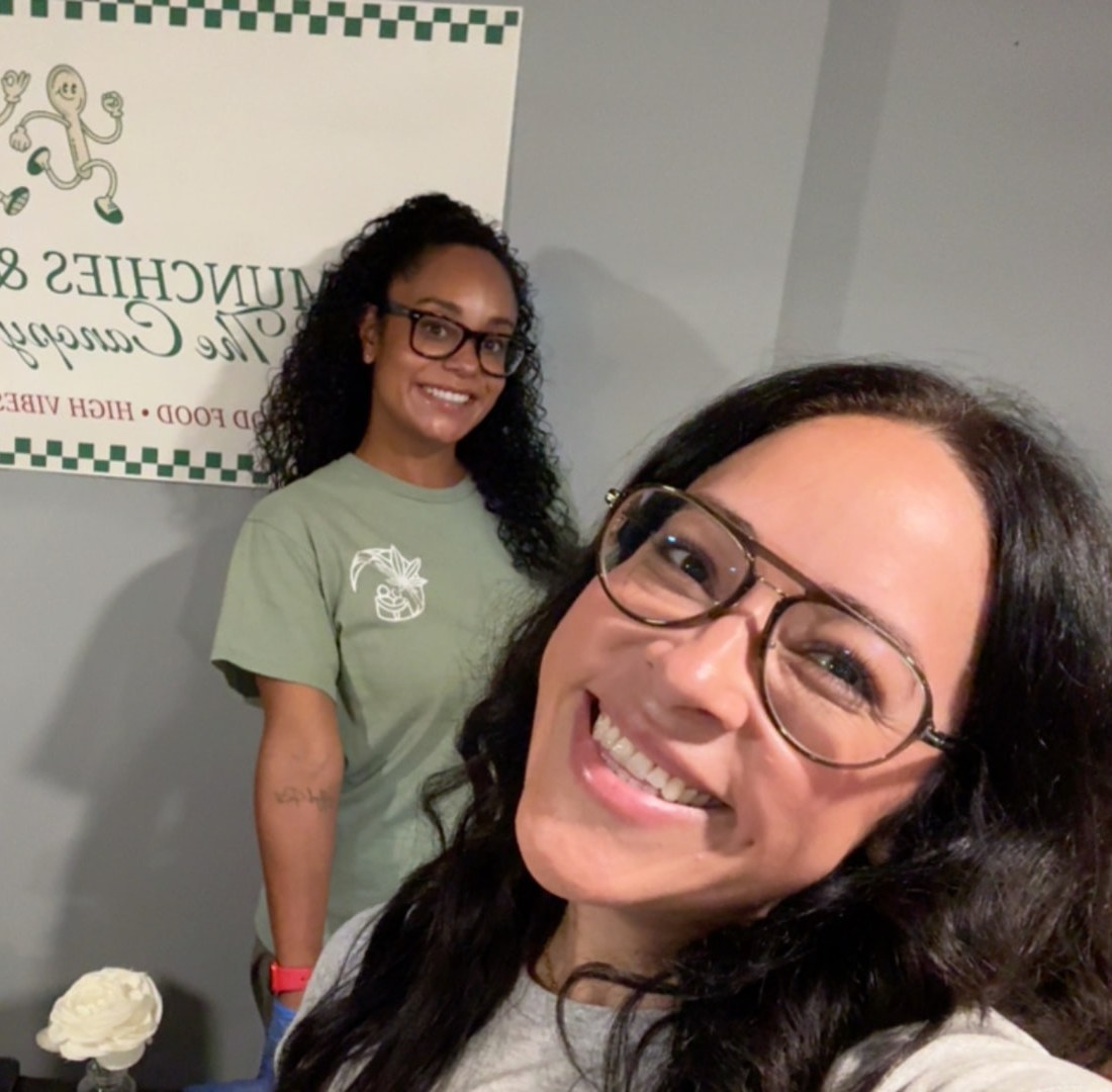 A community member smiling for a photo at a Canopy gathering.