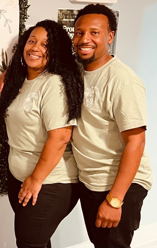Two community members smiling together at a recent gathering.